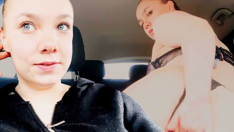 A young European does something illicit in a vehicle