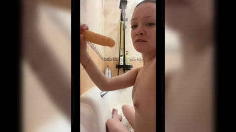 'Sassy young co-ed initiates her buddy's sexual awakening during sensual bath escapade'