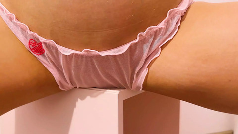 Raven-haired vixen thrusts hips against the table edge, pink lingerie a blur