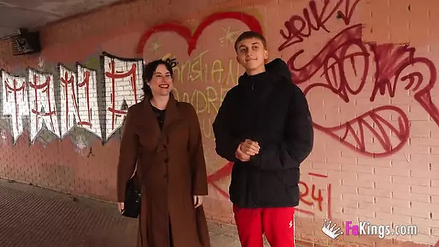 Emmita Smile tempts young men with her MILF allure and seductive charm