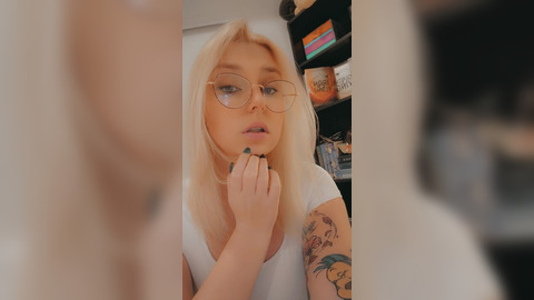 Blonde bombshell seduces with sultry eyes, fisting and licking her juicy g-spot
