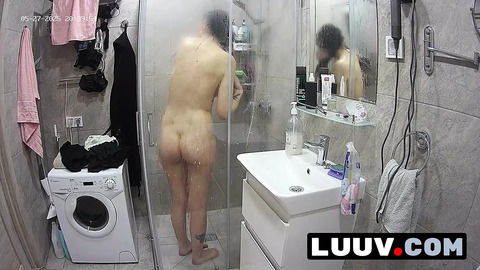 LUUV. Tattooed Alice gets ready for the evening reality show segment in the shower