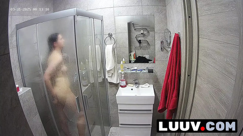 LUUV  A brunette showers —  used to amateur cameras —  showing her natural body